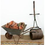 A garden roller, a wheel barrow, terracotta flower pots, etc Rust and wear, handle of roller