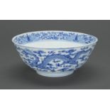 A Chinese blue and white dragon bowl, Qing dynasty, 19th c, 23cm diam Small chip on rim