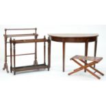 An oak stick stand, with metal drip tray, 76cm l, an oak towel rail, mahogany table with half