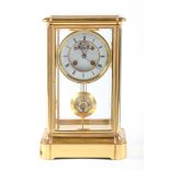 A French four glass clock, late 19th c, the enamel dial with visible brocot escapement, bell