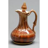A Rockingham decorated brown glazed and gilt jug and stopper, Isaac and Alfred Baguley, c1842-