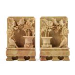 A pair of Chinese carved soapstone bookends,  early 20th c,  with a bird perched by flowers
