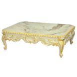 A marble, parcel gilt and white painted wood table, Thomas Messel Ltd, the cut cornered slab
