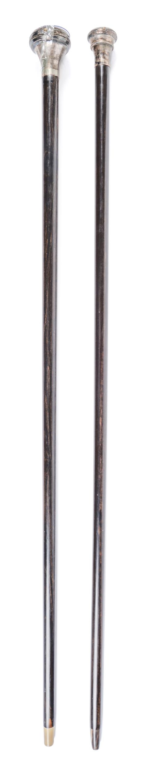 A silver mounted ebony gadget cane, the pommel incorporating a silver watch with enamel dial, horn - Image 2 of 3