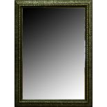 An ebonised and silvered mirror, late 19th c, splayed frame, 124 x 91cm Decoration slightly chipped,