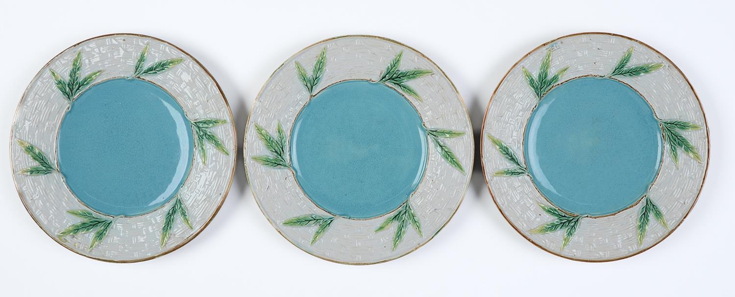 A set of three George Jones basket moulded majolica plates, c1870, with turquoise centre, the back