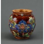 A German majolica cache pot, c1900, moulded with strapwork and ivy in vivid glazes, 19cm h,