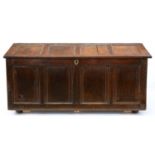 A panelled oak chest, first half 18th c, 61cm h; 55 x 136cm Splits and other damage and repair