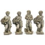 A set of four reconstituted stone garden statuettes of boys as The Seasons, second half 20th c, 72cm