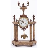 A French ormolu mounted marble clock, early 20th c, in Louis XVI style, the colonnade clock with urn