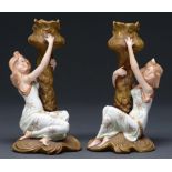 A pair of Ernst Wahliss figural candlesticks, c1900, the leafy naturalistic bronzed gilt candlestick
