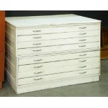 A pine and plywood plan chest, in two sections with panelled sides, later chrome handles, white