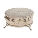 An Elizabeth II round silver trinket box, the engine turned lid engraved with a flower, on three