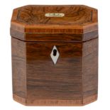 A George III rosewood tea caddy, of cut cornered shape, crossbanded and line inlaid, with ivory