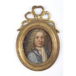 British School, early 18th c - Portrait miniature of a Gentleman, in a blue coat, oil on copper,