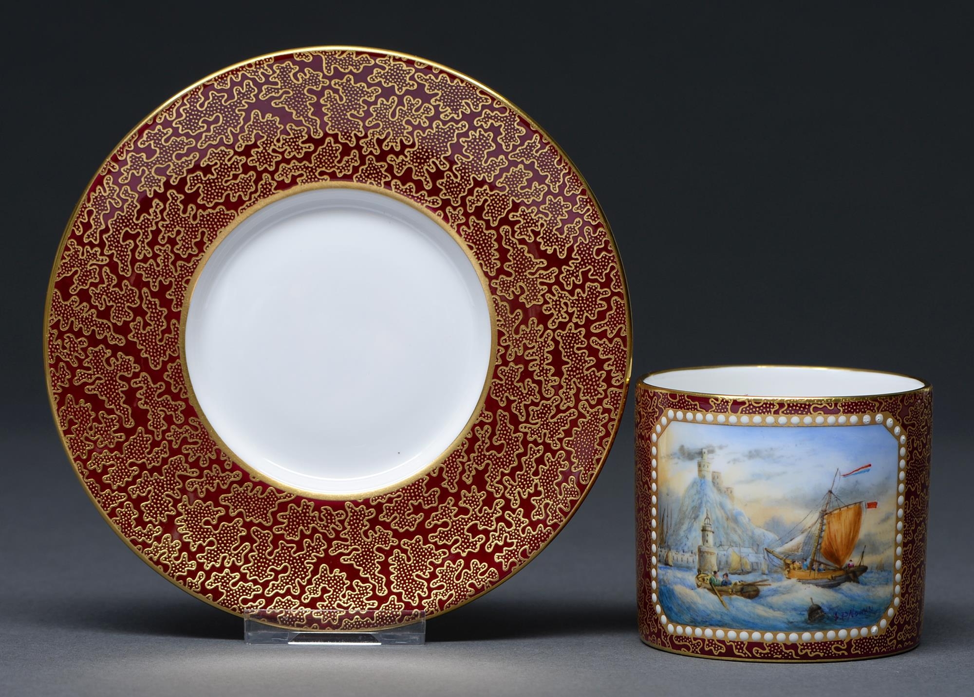 A Lynton coffee can and saucer, 20th / 21st c, the coffee can painted by S D Nowacki, signed, with a