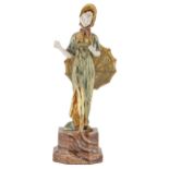 A gilt bronze and ivory statuette of young woman with a parasol, c1920, onyx base, 22cm h