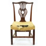 A George III mahogany dining chair, the carved and pierced back with vase splat, dished horsehair