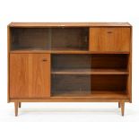 A mid-century teak bookcase, B & I Nathan, c1960, with glass sliding doors, 96cm h; 28 x 122cm,