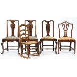 One and a pair of George II oak dining chairs, on cabriole legs united by turned stretchers, seat