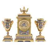 A French brass and champleve enamel garniture de cheminee, late 19th c, the pillar shaped clock