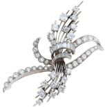 A diamond spray brooch, mid 20th c, with round brilliant and baguette diamonds, in white gold, 51mm,