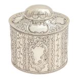 A Victorian silver tea caddy, with domed lid and reeded borders, stamped with foliage and vacant