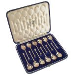 A set of twelve George V silver seal top replica coffee spoons, by The Goldsmiths & Silversmiths