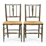A pair of Regency polychrome painted green ground rush seated bedroom chairs, seat height 45cm