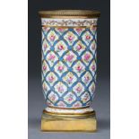A French ormolu mounted porcelain spill vase, 19th c, painted with single roses in blue ribbon