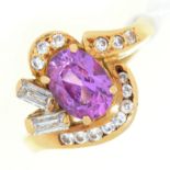 An amethyst and diamond cluster ring, in gold marked 750, 5.7g, size J½ ConditionGood condition