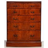 An Edwardian flame figured mahogany bow fronted chest of drawers, crossbanded in rosewood and line