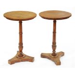 A pair of oak lamp tables, the quarter sawn round top on ring turned pillar with vase knop and tri-