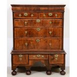 A Queen Anne walnut chest on stand, quarter veneered top with wide burr walnut crossbands and