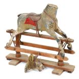 A rocking horse, F H Ayres, early 20th c, retaining extensive original paint, glass eyes, leather
