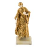 Ch. Peron. A gilt bronze and ivory statuette of a young woman descending steps a bravery in her