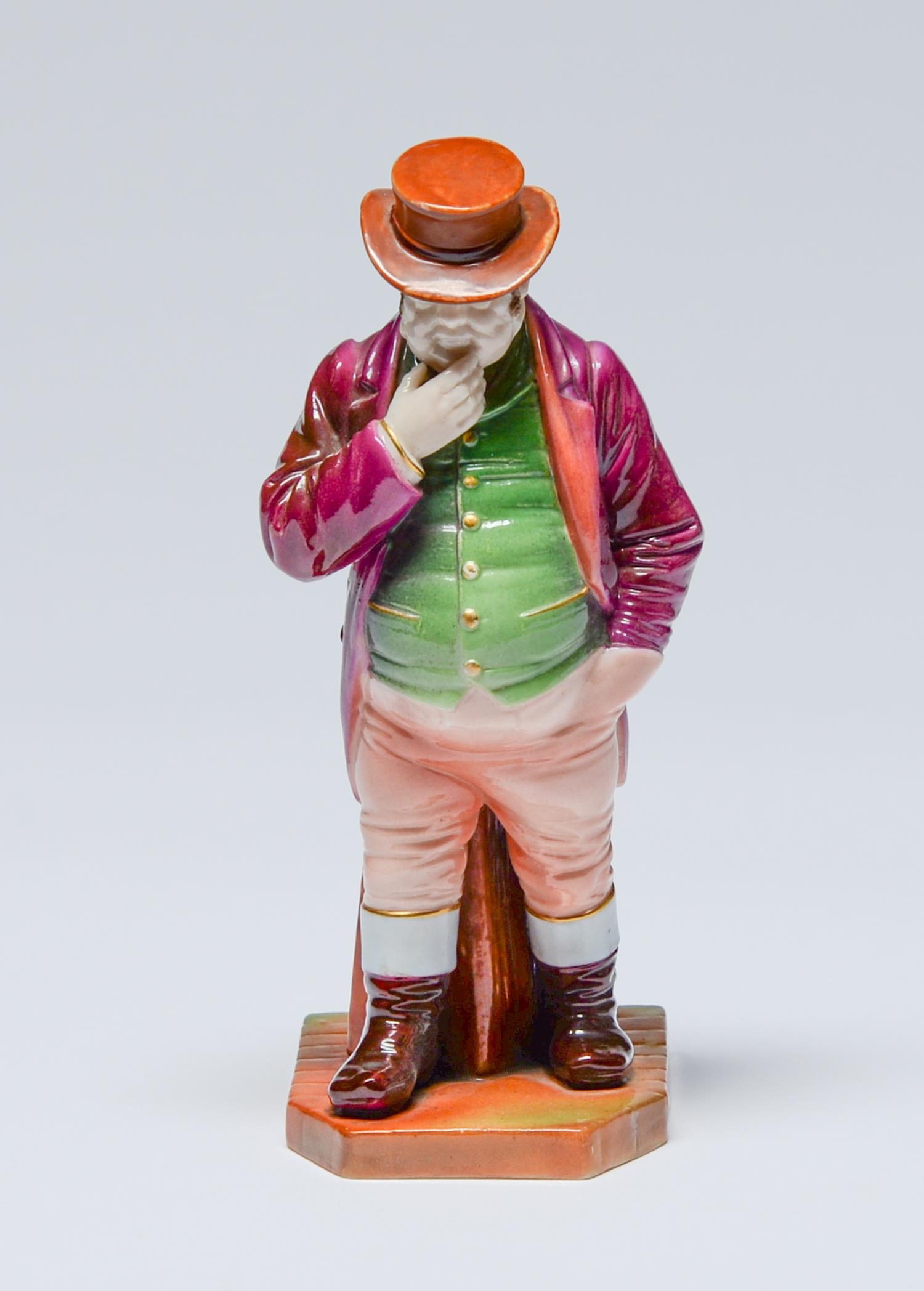 A Royal Worcester figure of John Bull, 1901, designed by James Hadley, in green waistcoat, pink