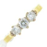 A three stone diamond ring, in gold, marked DIA .50 18CT, 3.2g, size J Condition