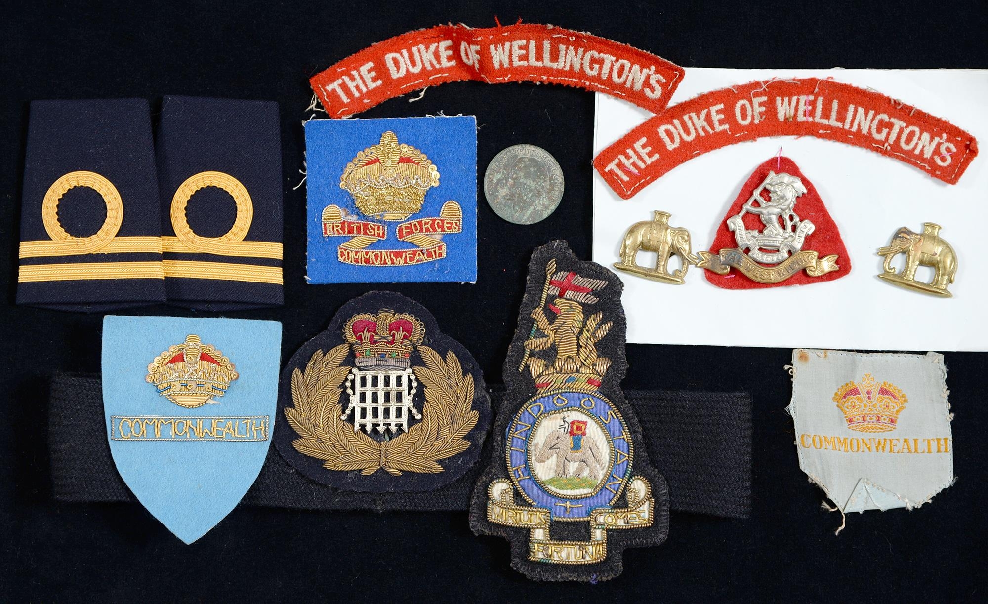 Miscellaneous British army and naval cloth insignia and Duke of Wellington's Regiment cap and