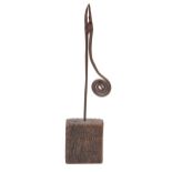 A wrought iron rush nip, on wood block, 41.5cm h ConditionIron rusty, complete, otherwise undamaged