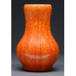 A Pilkingtons Royal Lancastrian vase, c1930, with carved detail in Orange Vermillion glaze, 24.5cm