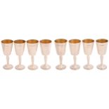 A set of eight Elizabeth II silver goblets, the rounded funnel bowl raised from the flat, on