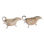 A pair of George V silver sauce boats, with flying scroll handle, on hoof feet, 14.5cm l, by