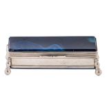 A nickel plated brass and blue stained agate inset postage stamp box, early 20th c, 85mm l