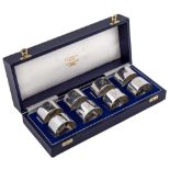 A set of eight Elizabeth II silver napkin rings, initialled H, by C J Skelhorne, Birmingham 2000,