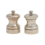 A pair of Elizabeth II silver pepper mills, 67mm h, by P H Vogel & Co, Birmingham 1990 and 1993