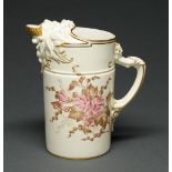 A Royal Worcester lion mask jug, 1888, with gilt shell lip, decorated in pink and brown with