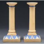 A pair of Wedgwood smear glazed drabware candlesticks, c1830, ornamented in blue with acanthus