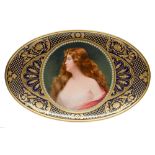 A Berlin oval dish, c1900, finely painted by Wagner, signed, with a bust length portrait of a