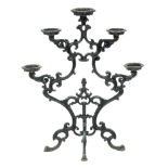 A Victorian cast iron plant stand, for five flowerpots, on leafy scrolling branches and quadruple